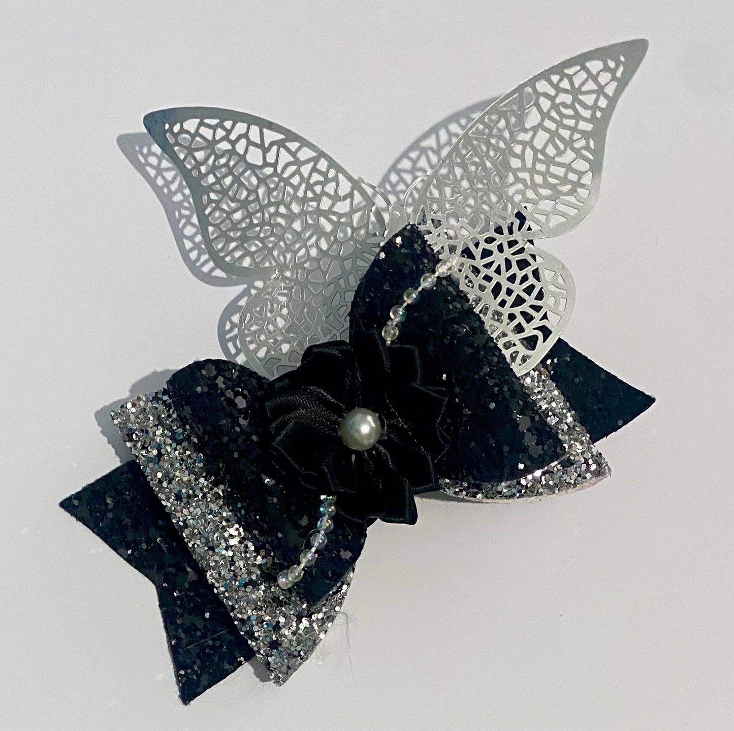 Black and silver hair clip with large butterfly