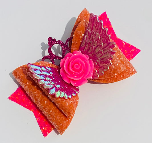 Bright orange and pink hair bow clip with flower centre