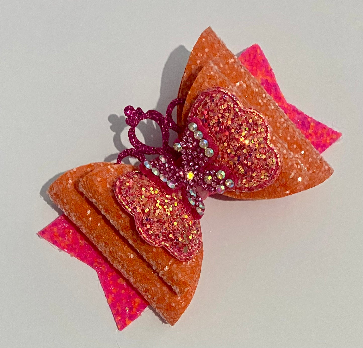 Bright orange and pink hair bow clip